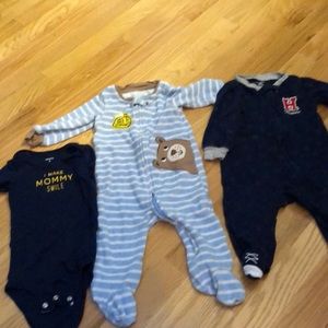 Two pajamas and one onesie Carter’s size 9 months